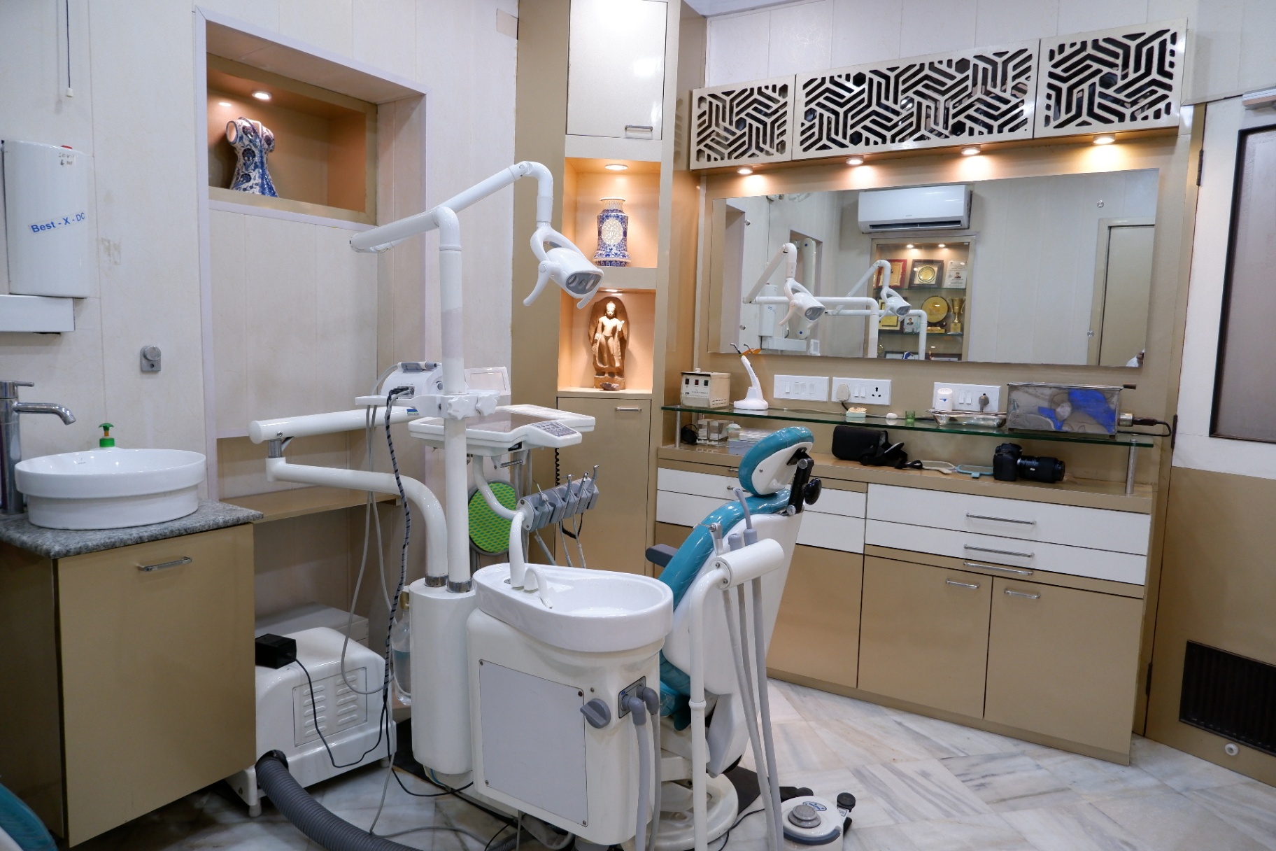 Modern dental chair with overhead light and instrument panel at OroCare Dental Clinic, Bhowanipur